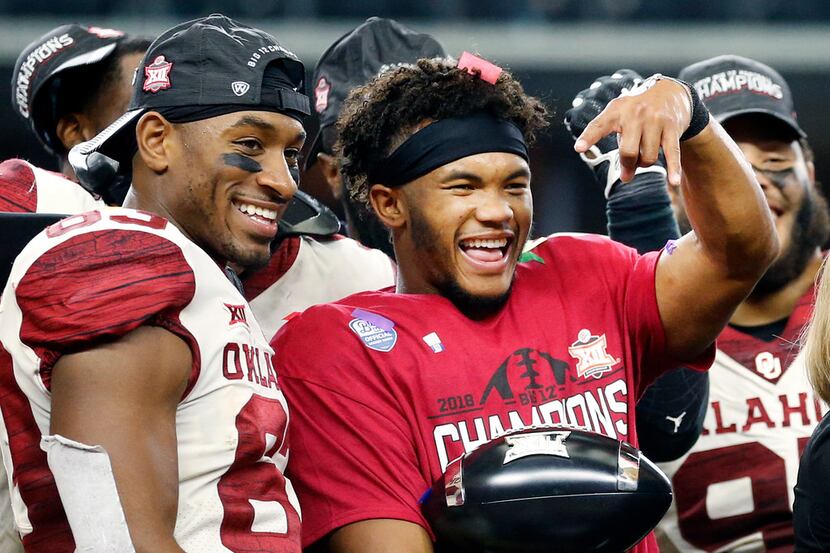 Oklahoma Sooners quarterback Kyler Murray give the horns down hand signal after receiving...