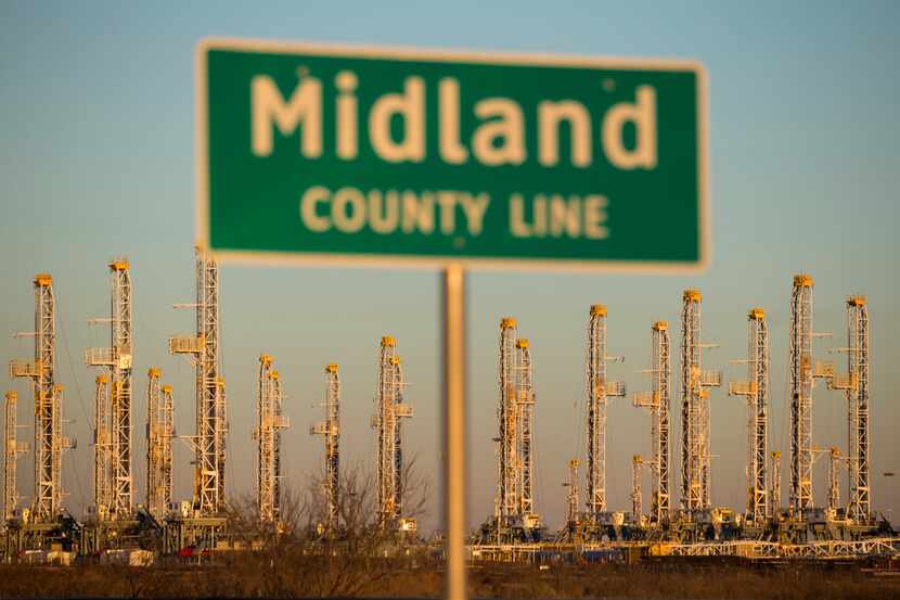 FILE photo shows oil rigs stacked for storage near Midland, Texas in the heart of Permian...
