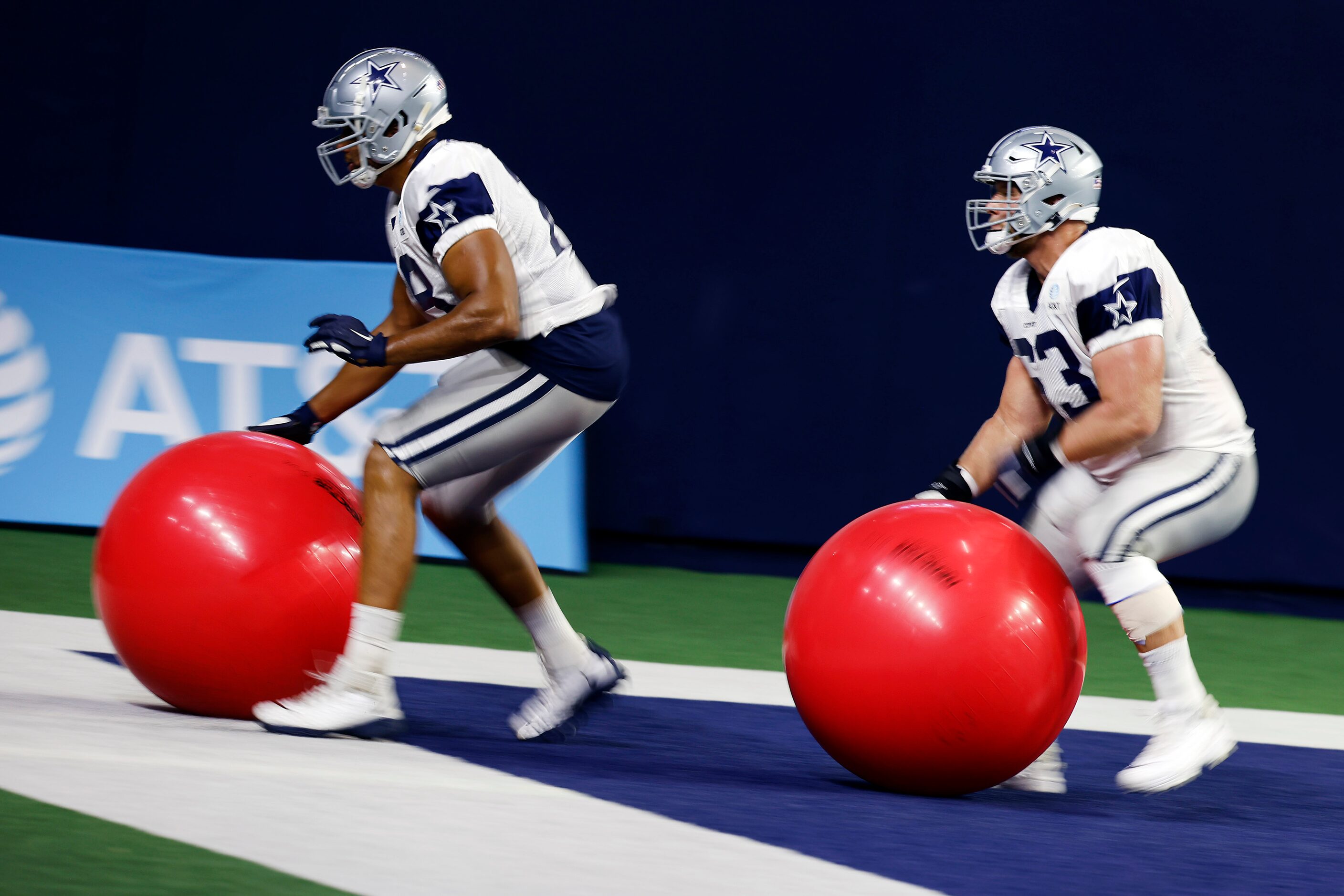 Dallas Cowboys tackle Terence Steele (78) and center Tyler Biadasz (63) back peddle with...