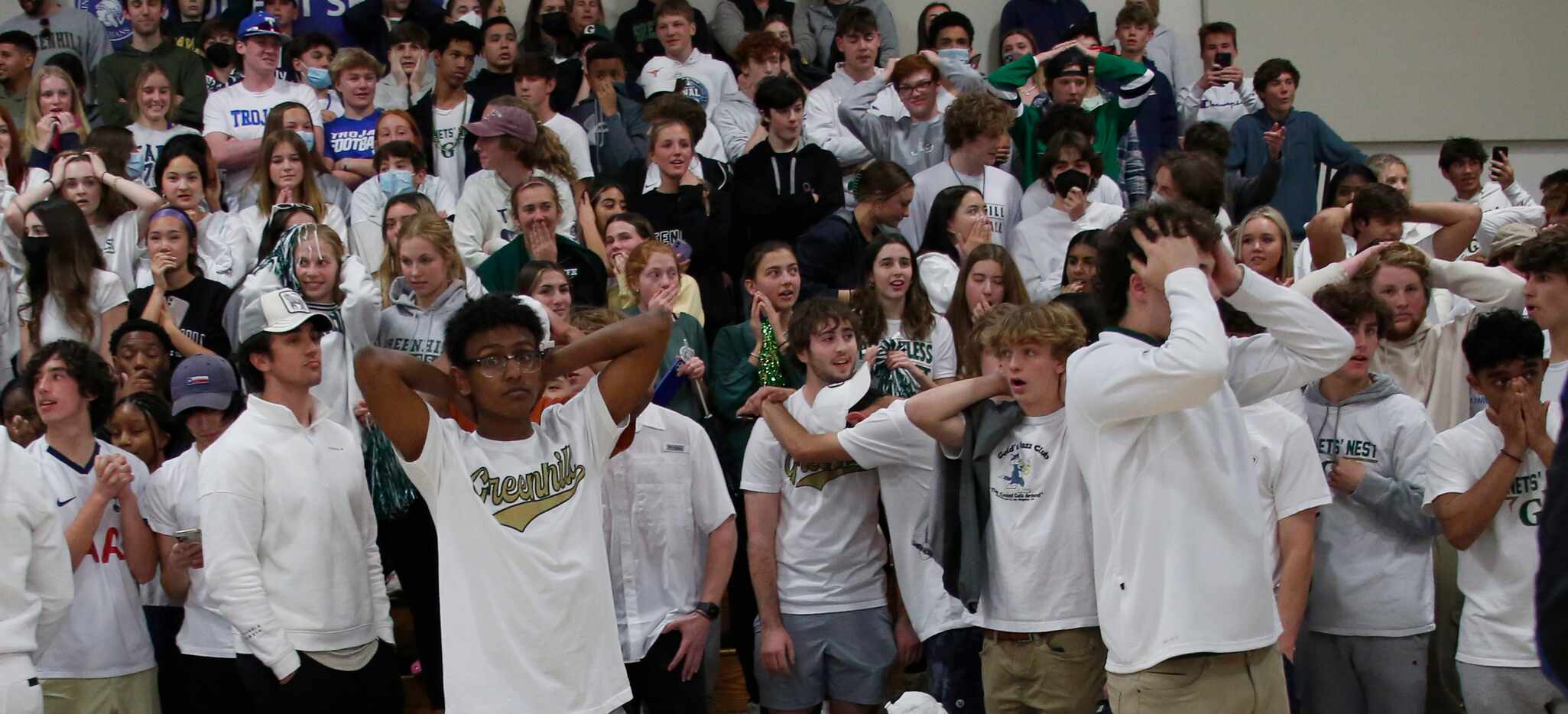 Greenhill fans filling the student section react in shock after a buzzer beater by Houston...