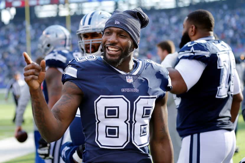 Dallas Cowboys wide receiver Dez Bryant (88) keeps it lighthearted on the sideline before...