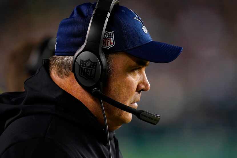 Coach Mike McCarthy watches during the second half of the Cowboys' game against the Eagles...