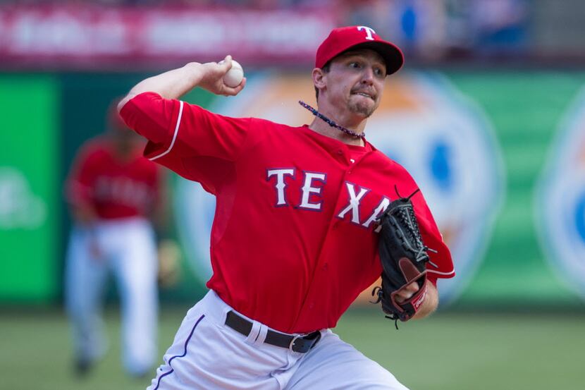 Texas Rangers starting pitcher Tanner Scheppers (52) pitches against the Cleveland Indians...