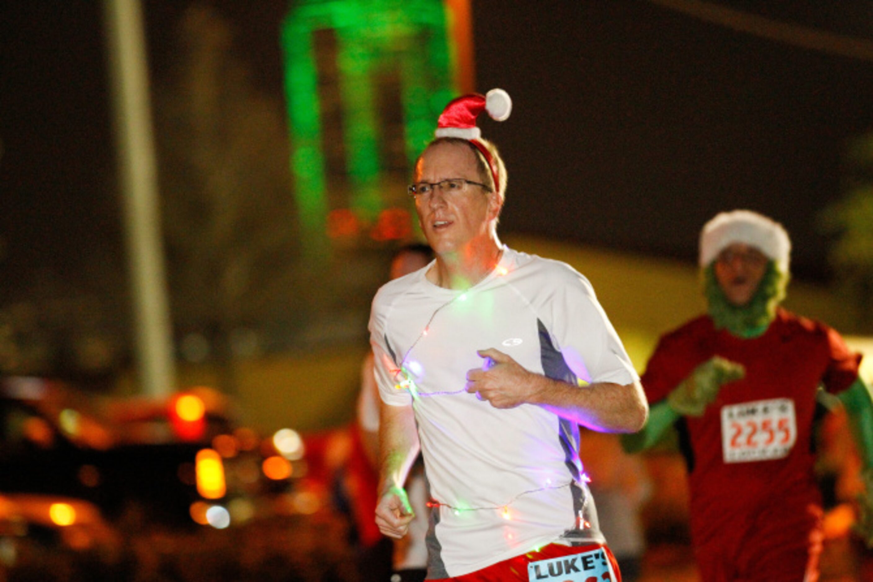 Thousands of runners take the streets for the Jingle Bell Run outside the Hilton Anatole in...