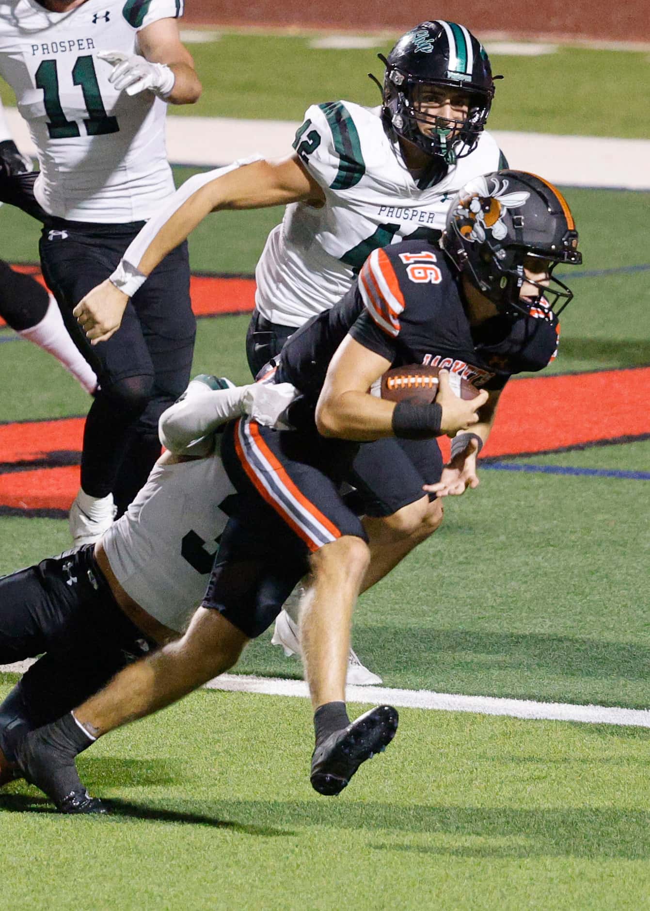 Rockwall's Mason Marshall (16) scores a touchdown as Prosper's Bo Mongaras (3) tries to stop...