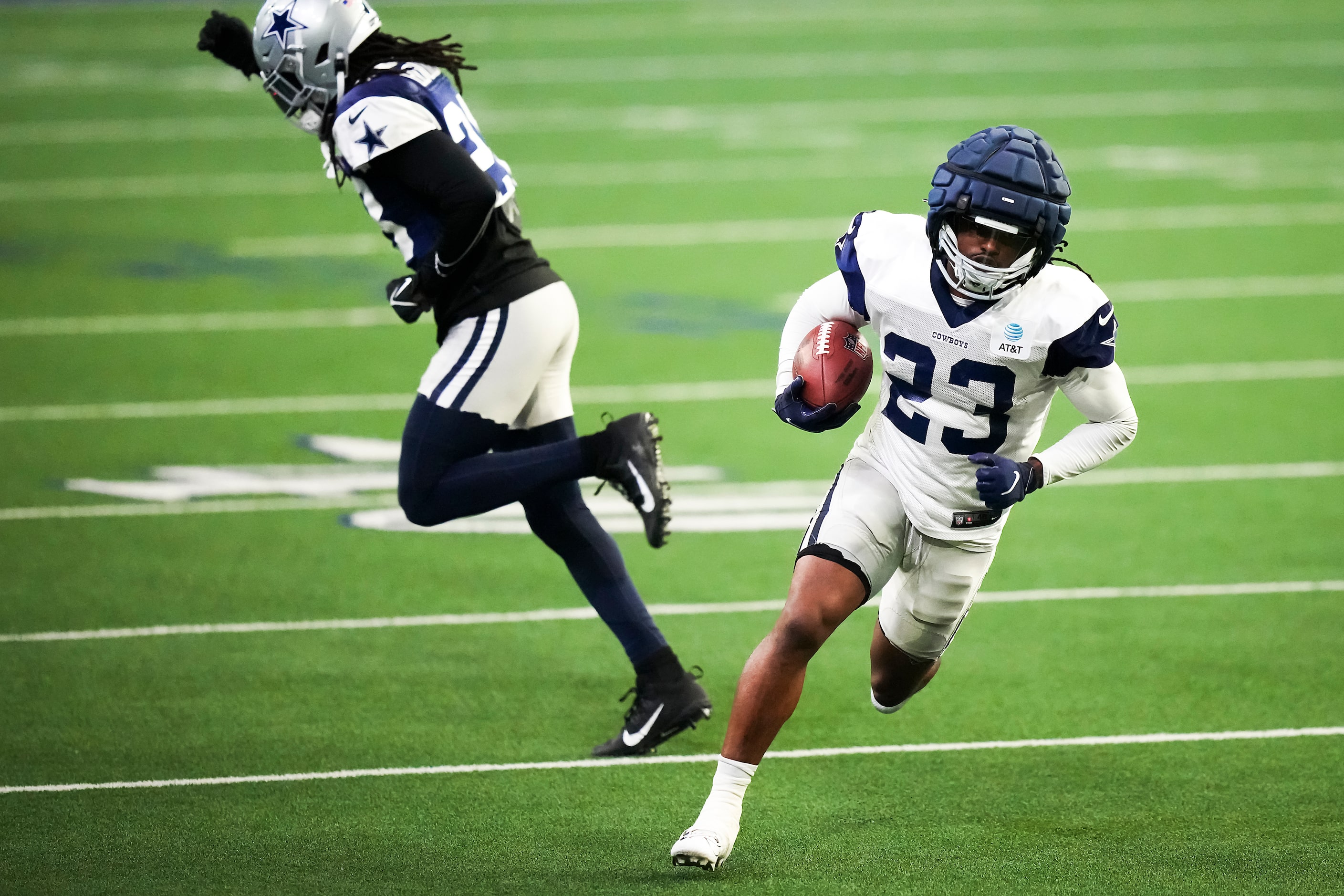 Dallas Cowboys running back Rico Dowdle (23) runs past free safety Malik Hooker (28) during...