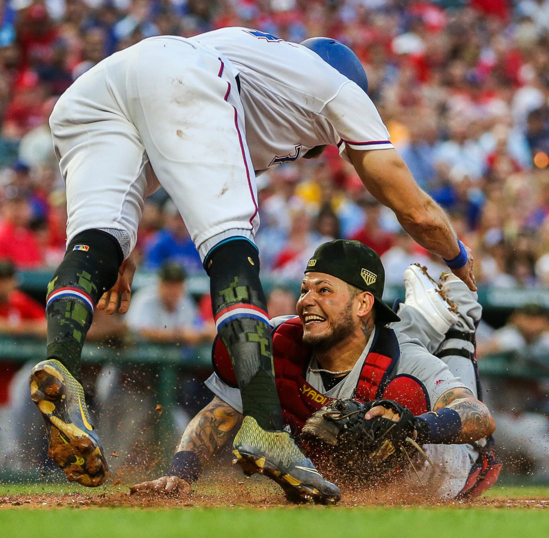 St. Louis Cardinals catcher Yadier Molina (4) tags out Texas Rangers designated hitter...