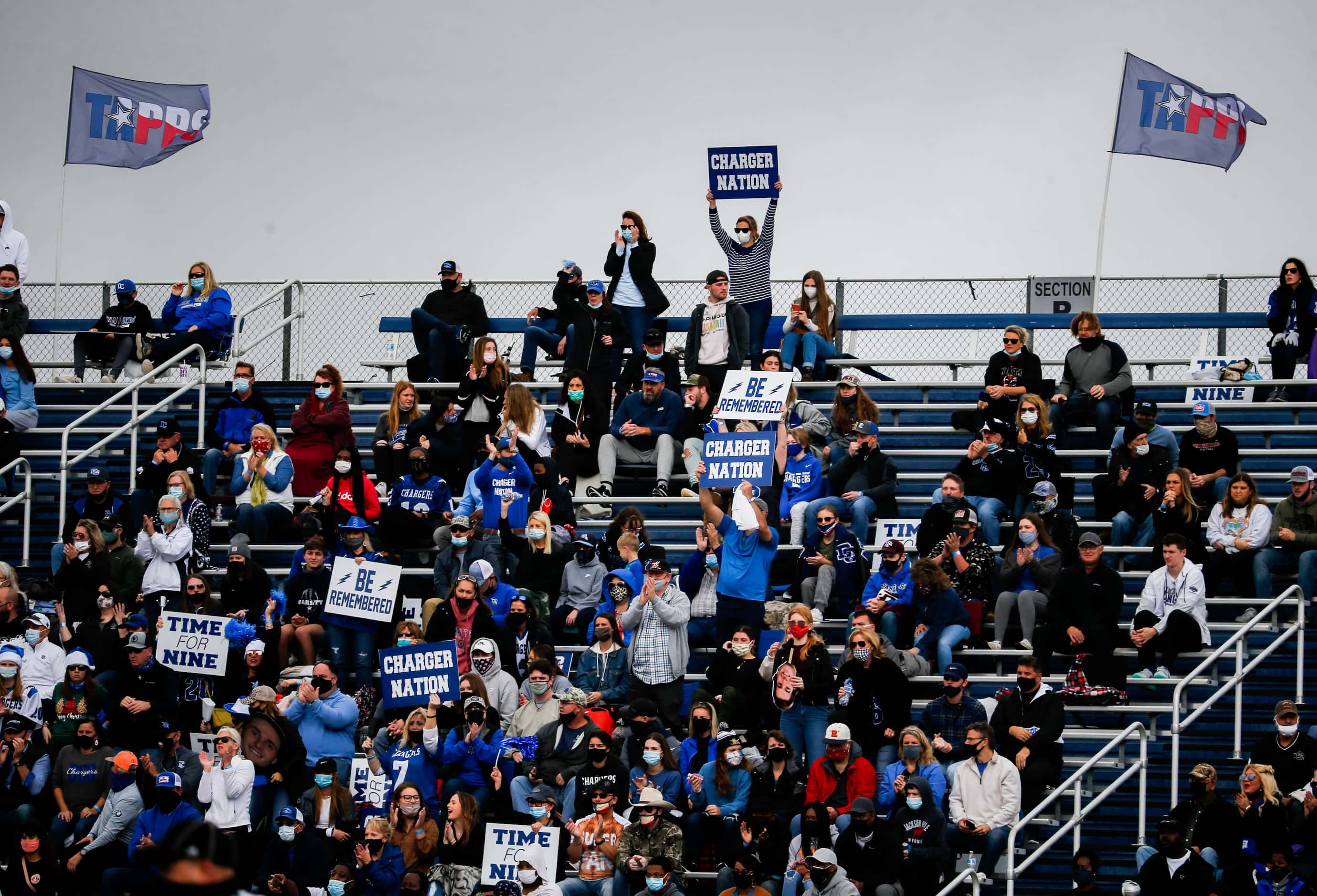 Dallas Christian fans cheer during the first half of a TAPPS Division II state championship...