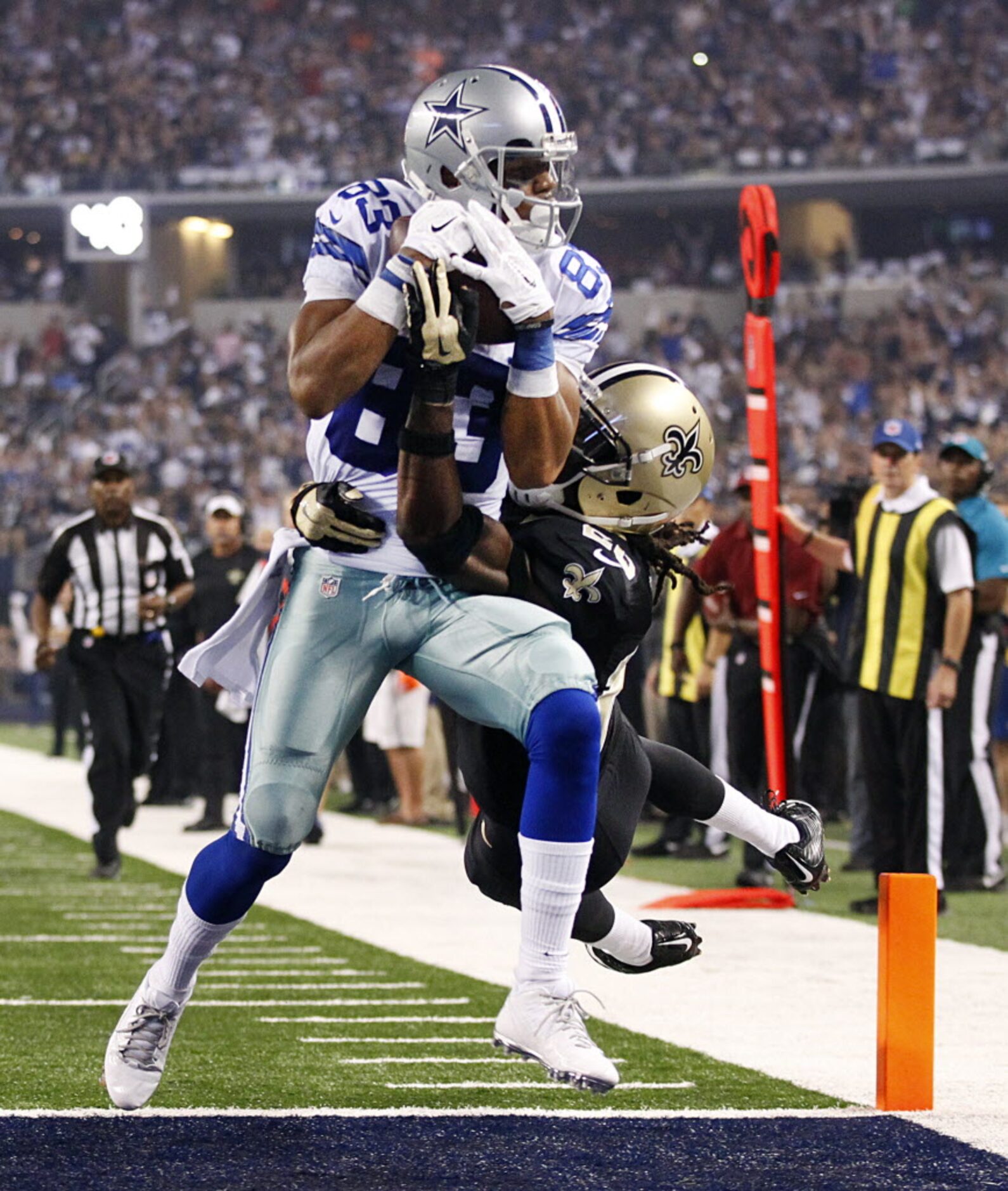 Dallas Cowboys wide receiver Terrance Williams (83) carries New Orleans Saints defensive...