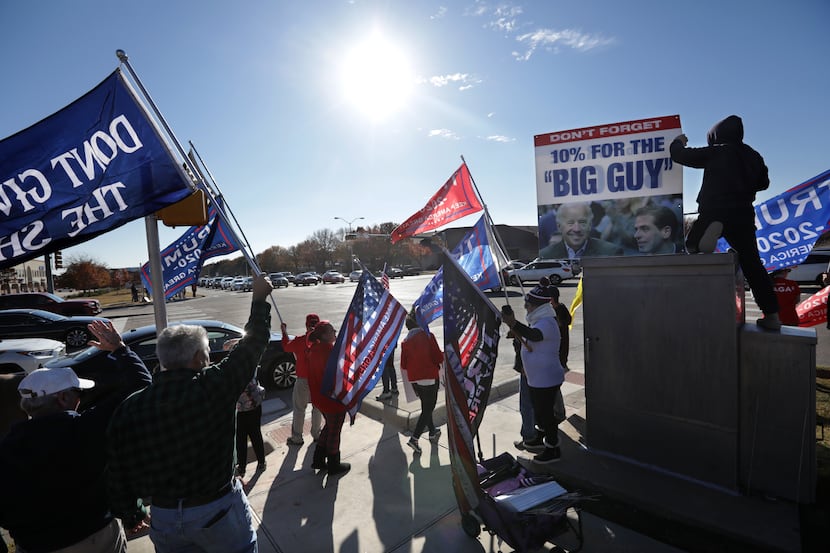 Trump supporters demonstrate at the corner of Preston Rd and Parker Rd in Plano, TX, on Dec....