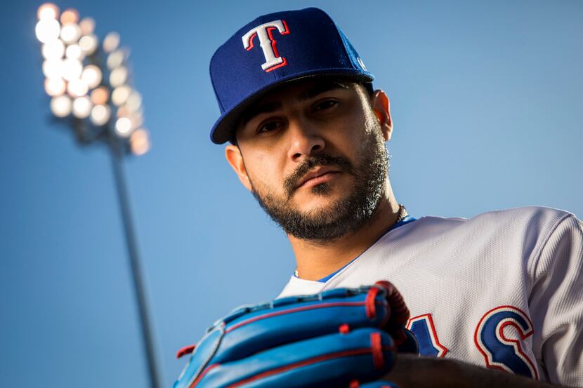 Texas Rangers pitcher Martin Perez poses for a photo during Spring Training picture day at...