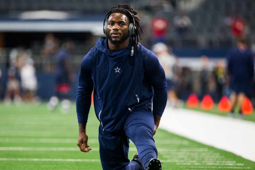 Dallas Cowboys middle linebacker Jaylon Smith (54) stretches before an NFL game between the...