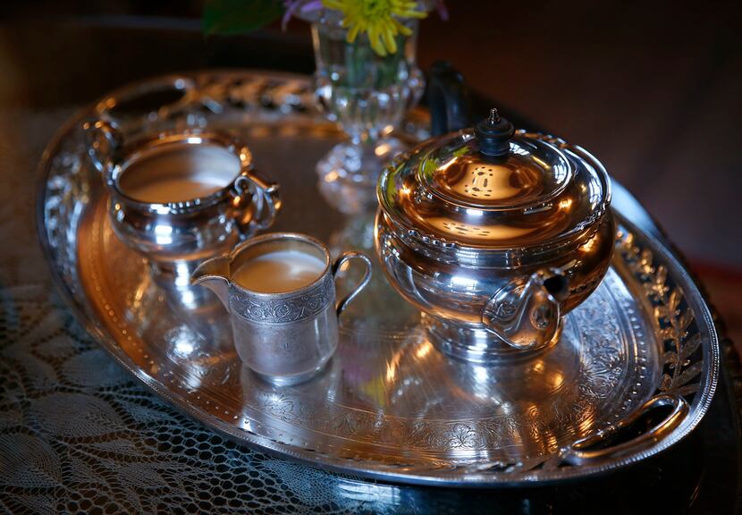 A silver tea service with sugar, creamer and teapot on silver tray at Aldredge House