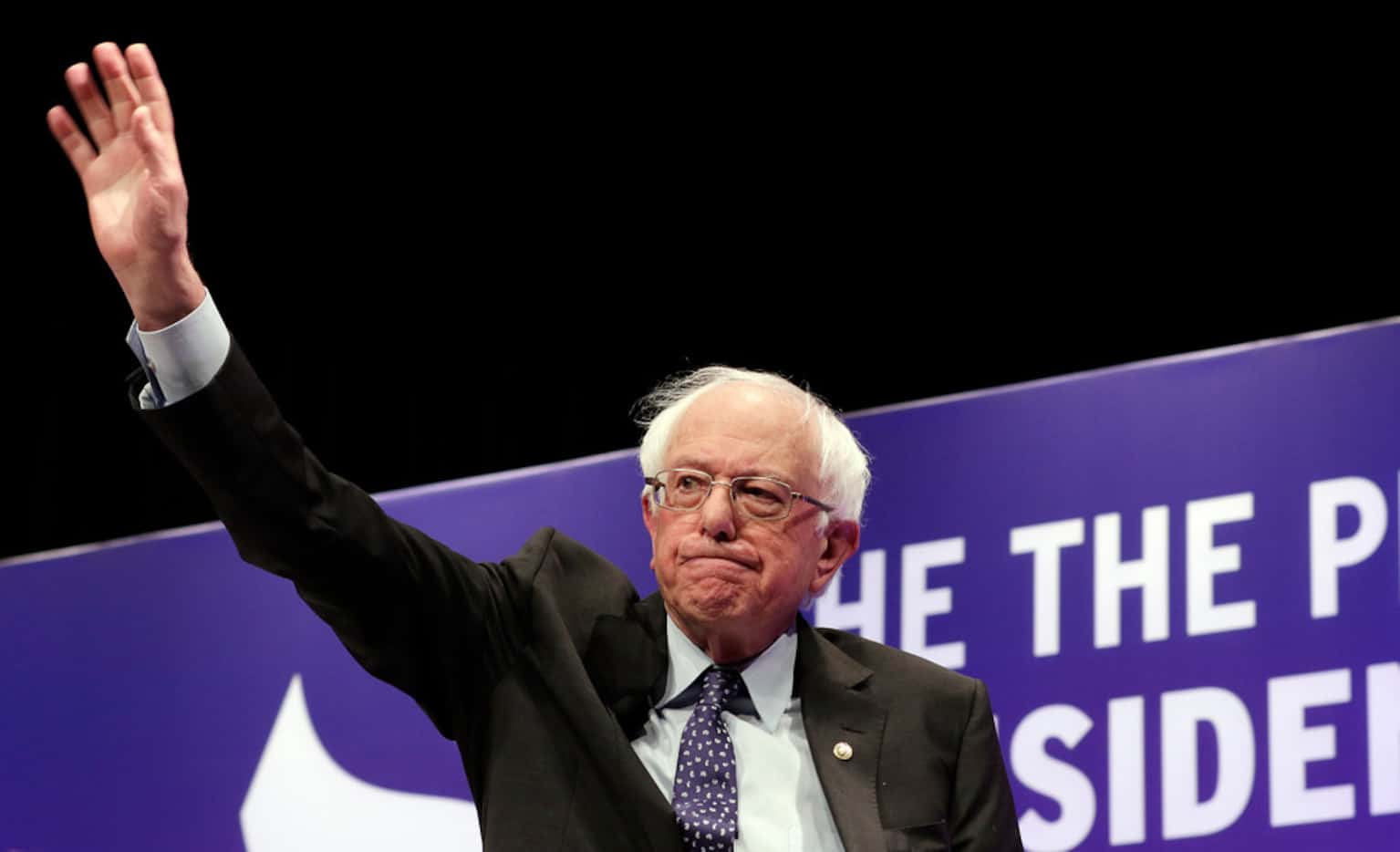 Democratic presidential candidate Sen. Bernie Sanders, I-Vt., waves as he attends a...