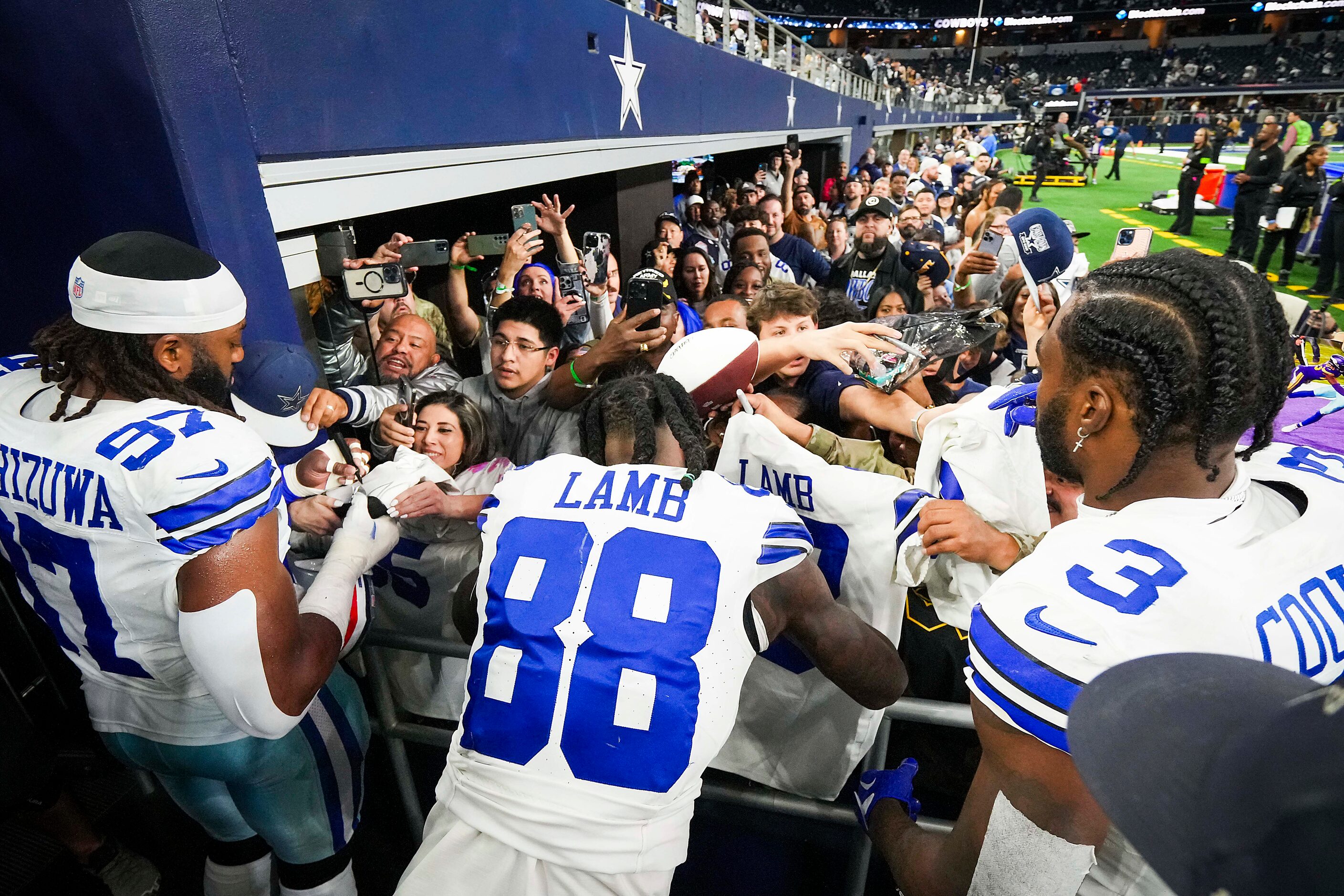 Dallas Cowboys defensive tackle Osa Odighizuwa (97), wide receiver CeeDee Lamb (88) and wide...