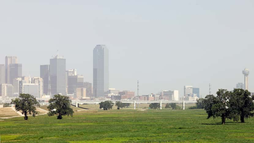 The downtown Dallas skyline is seen through a haze of Saharan dust, Wednesday, July 31, 2024.