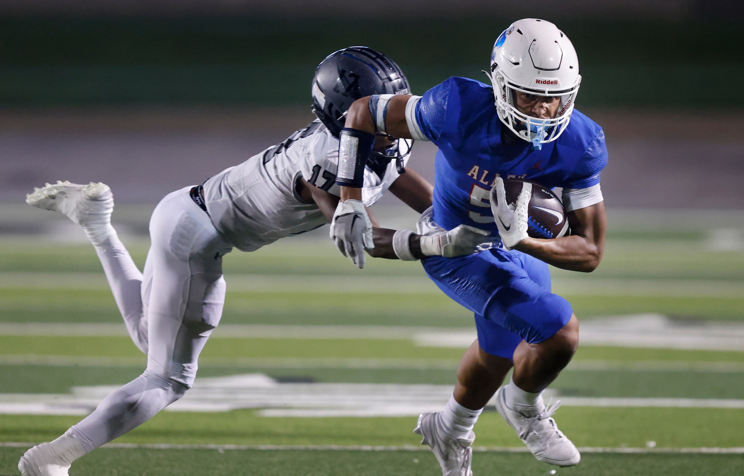 Allen wide receiver Quinton House-Hammonds (5) attempts to shake Arlington Martin defensive...