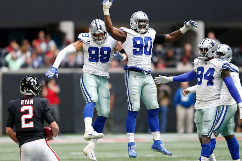 Dallas Cowboys defensive tackle Tyrone Crawford (98) congratulates Dallas Cowboys defensive...