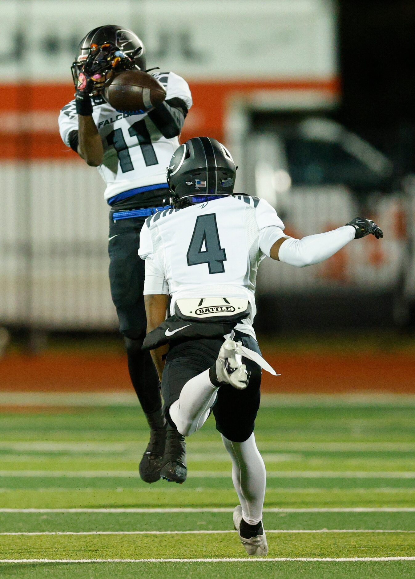 North Forney wide receiver Jaquarion Robinson (11) makes a leaping catch during the first...