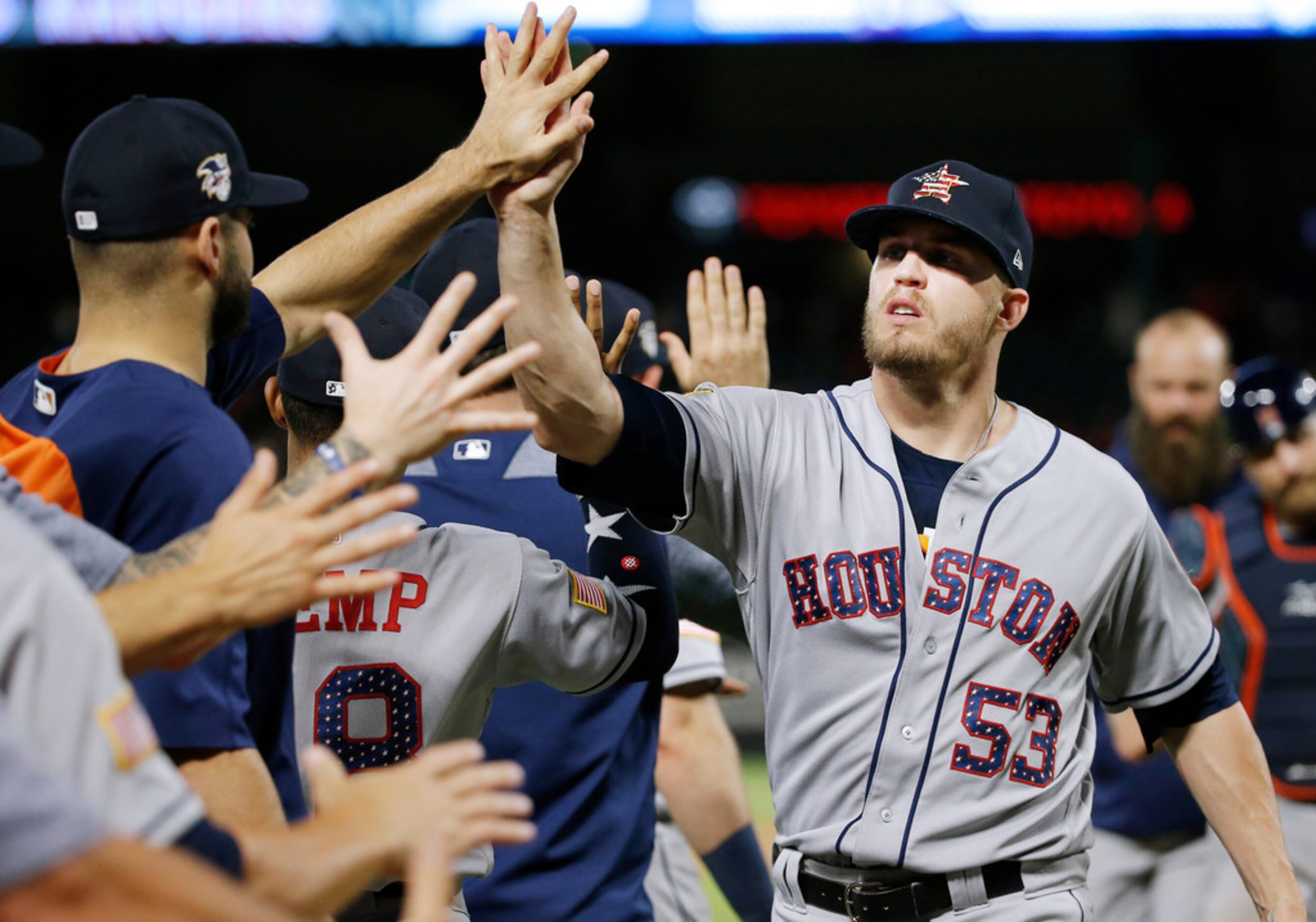 Houston Astros relief pitcher Ken Giles (53) is congratulated by teammates after the team's...