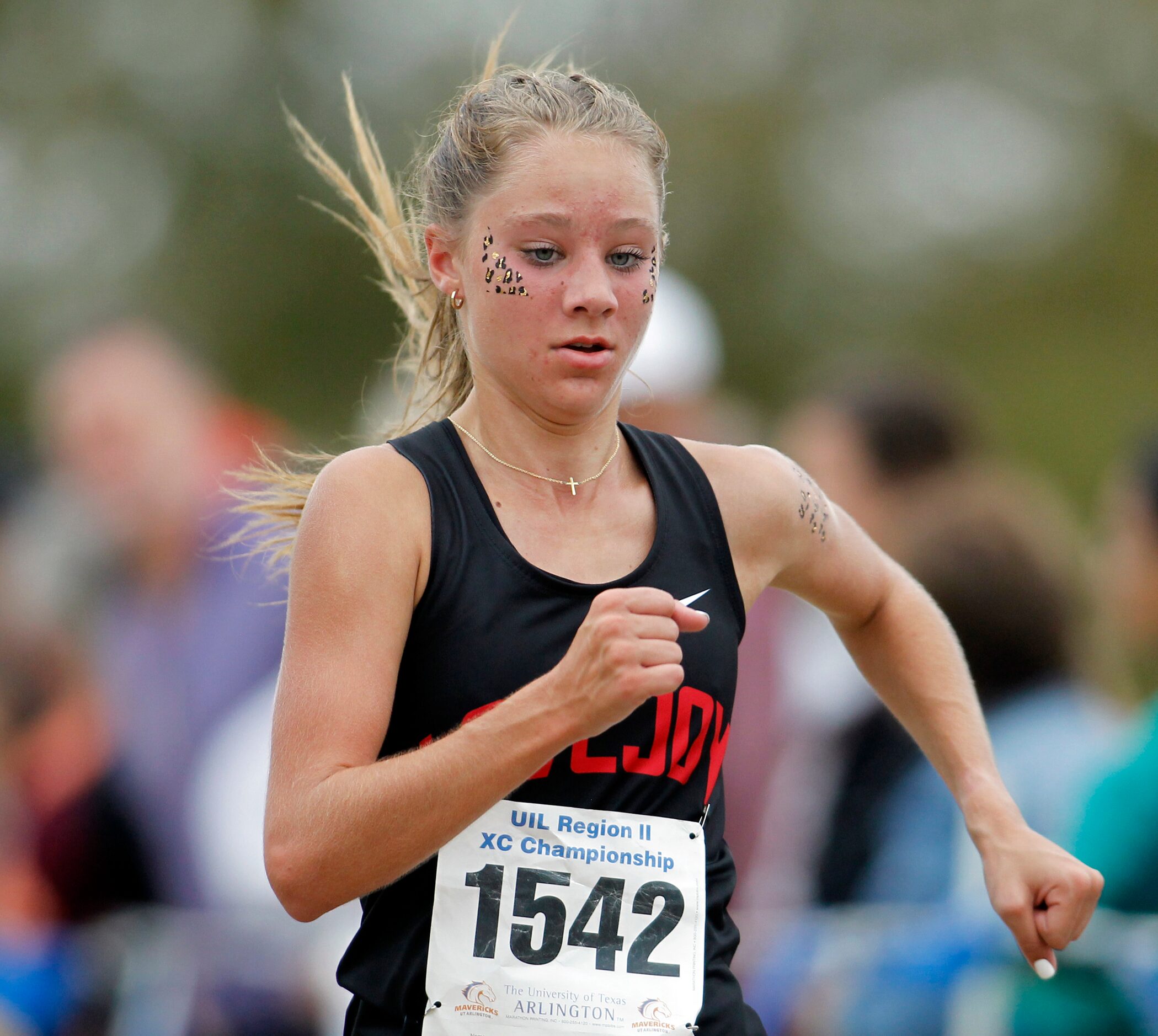 Lucas Lovejoy sophomore Camryn Benson heads to the finish line to capture second place with...