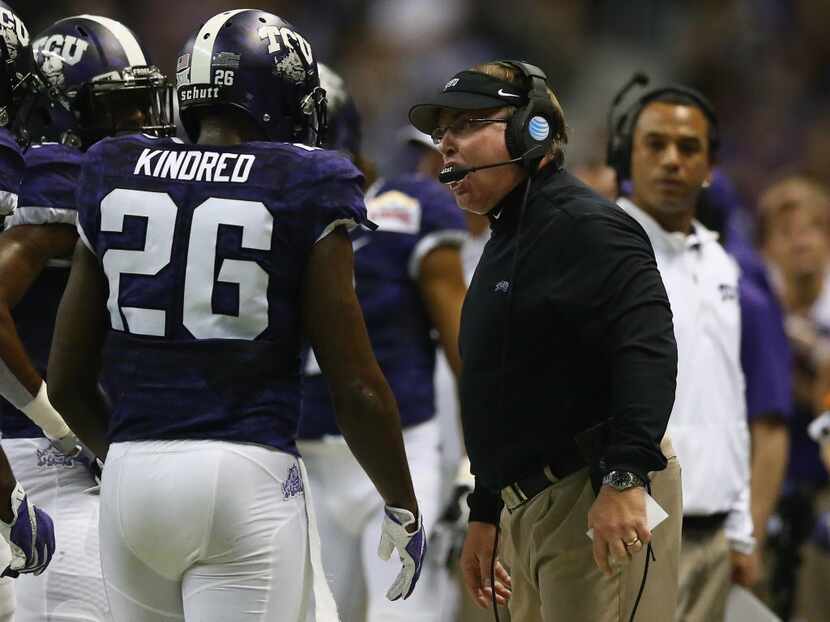 SAN ANTONIO, TX - JANUARY 02:  Head coach Gary Patterson of the TCU Horned Frogs talks with...