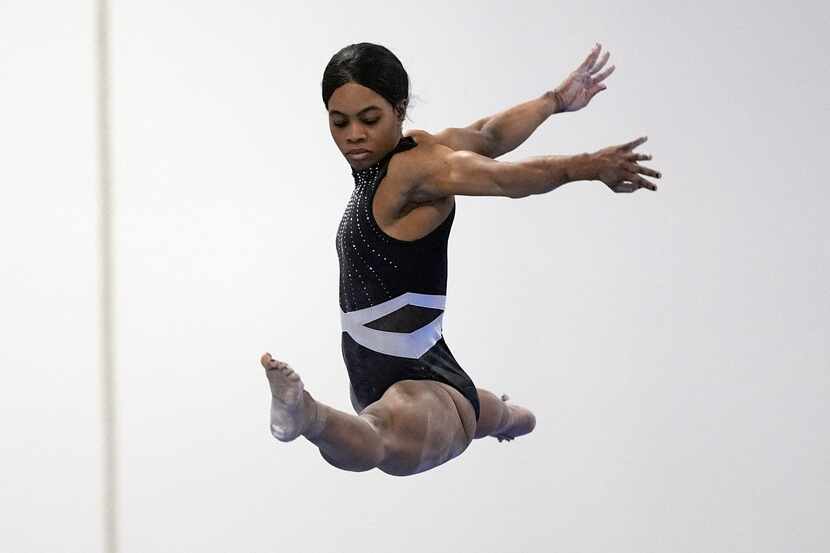 Gabby Douglas competes on the balance beam at the American Classic, in Katy, Texas, April...