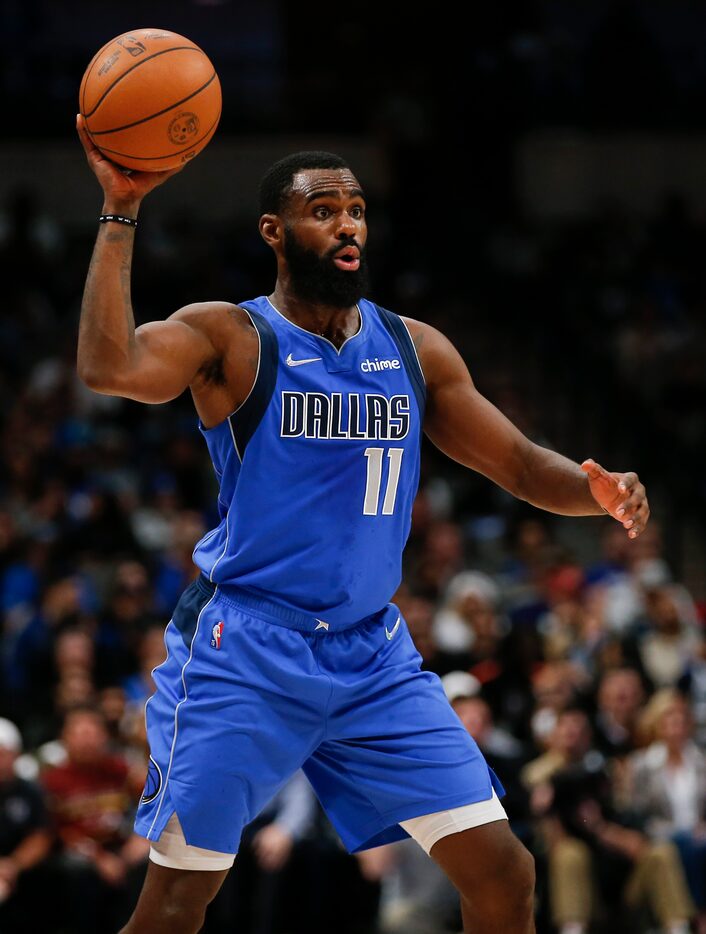 Dallas Mavericks forward Tim Hardaway Jr. (11) looks for space against the Charlotte Hornets...