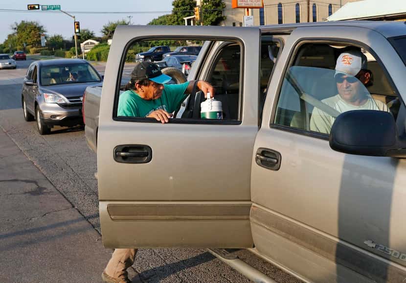 
Larry Hernandez, 53, gets a ride from an employer at Marsalis Avenue and Davis Street in...
