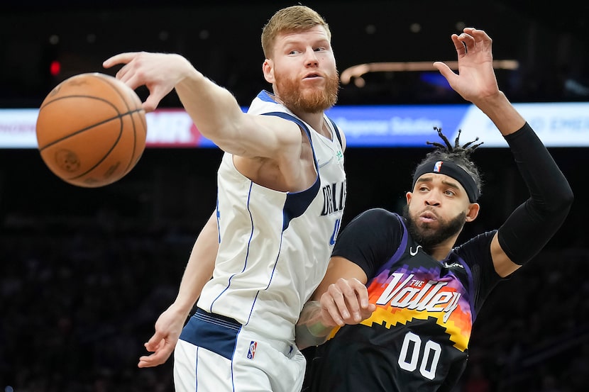 Dallas Mavericks forward Davis Bertans (44) knocks the ball away from Phoenix Suns center...