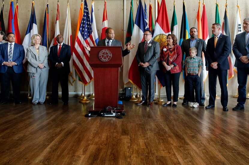 The Dallas City Council along with Mayor Eric Johnson (at podium) celebrated a unanimous...