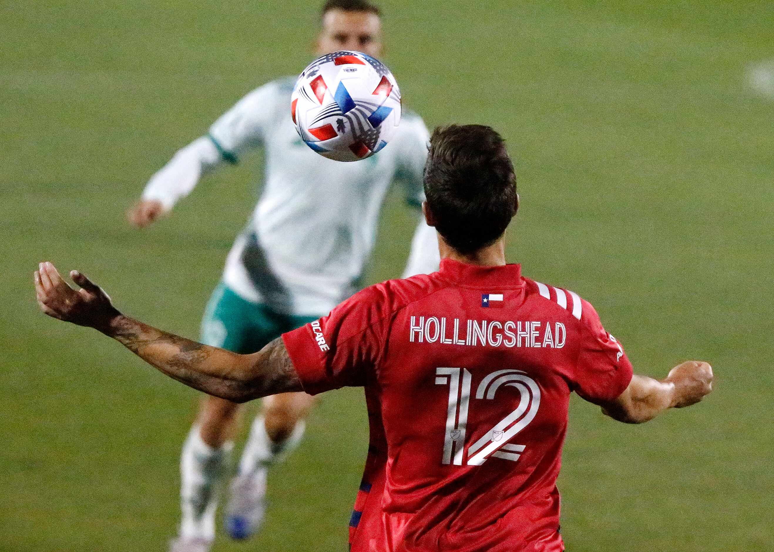 FC Dallas midfielder Ryan Hollingshead (12) stops a pass as Colorado Rapids midfielder...