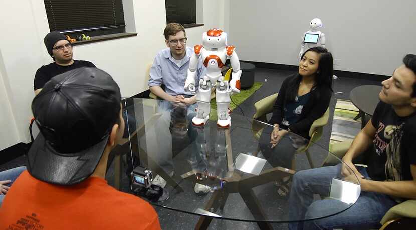 Students at the University of Texas at Arlington meet NAO, a robot designed to be an...