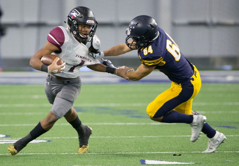 Timberview running back Stacy Sneed (1) tries to break free from Highland Park defensive...