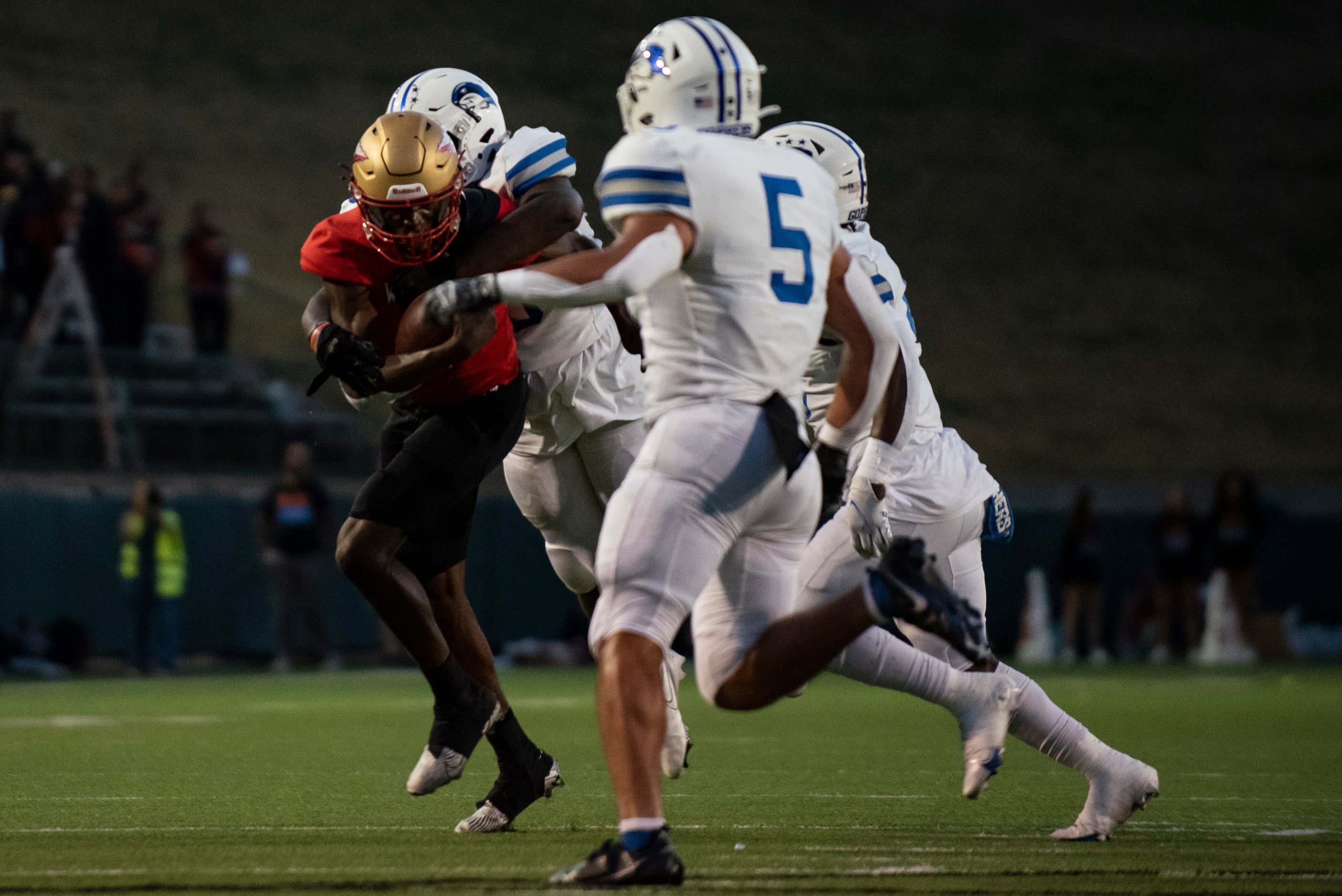 South Grand Prairie senior Michael Stallworth (7) is tackled by Grand Prairie senior Zarius...