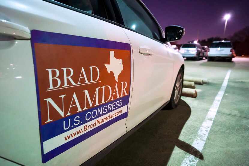 A sign for candidate Brad Namdar is seen on a vehicle during a forum Feb. 9 at the Museum of...