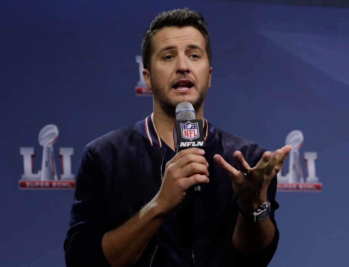 Luke Bryan answers questions at a news conference for the NFL Super Bowl 51 football game...