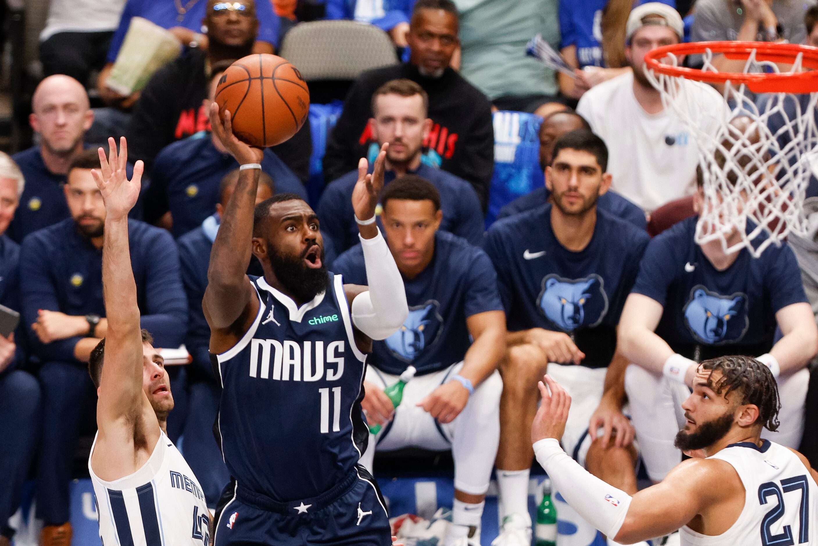 Dallas Mavericks forward Tim Hardaway Jr. (11) floats a shot over Memphis Grizzlies guard...