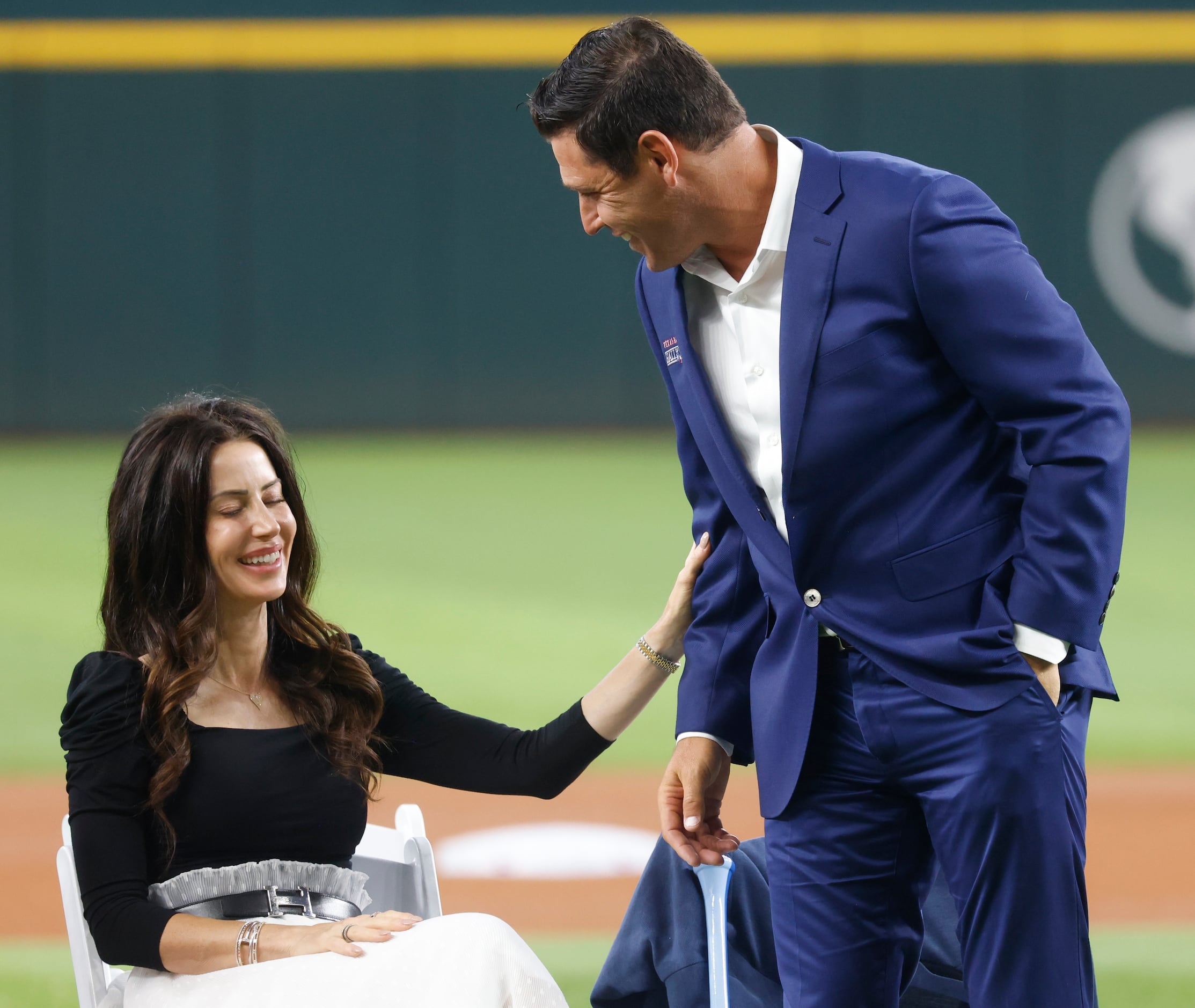 Former Texas Ranger Ian Kinsler, right, and his wife Tess Brady shares a moment after his...