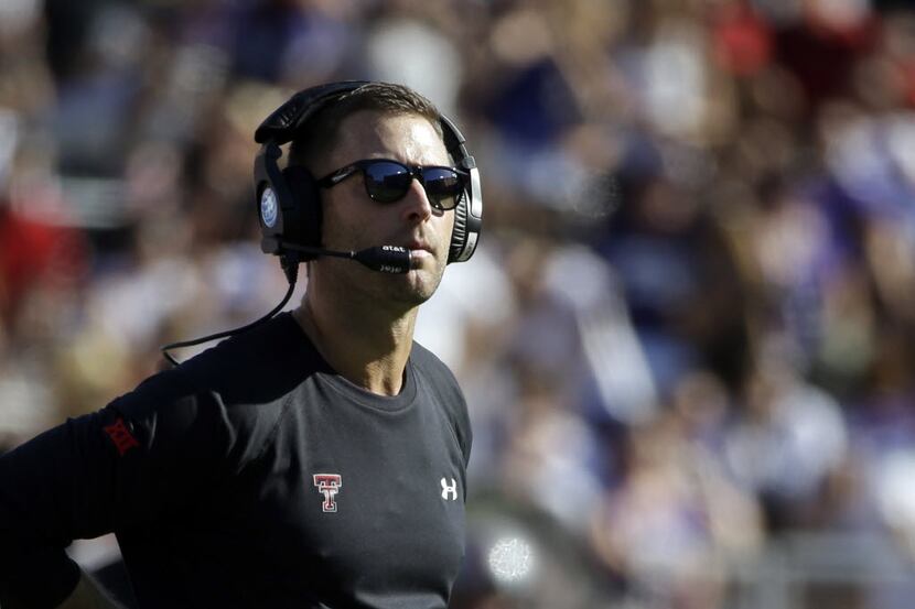 FILE - In this Oct. 25, 2014, file photo, Texas Tech head coach Kliff Kingsbury watches play...