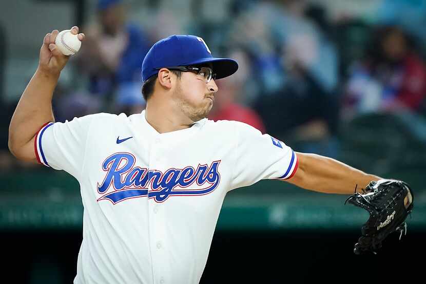 Texas Rangers pitcher Dane Dunning delivers during the first inning against the Baltimore...