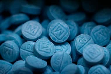 Hundreds of seized fentanyl pills that imitate Oxycodone M30 are shown at the Drug...