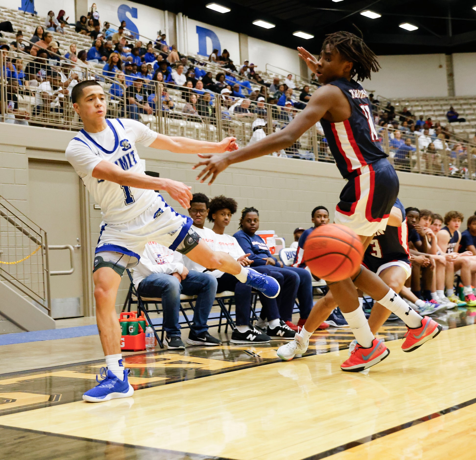 Summit Mansfield’s Theo Brannan (left) pass the ball past Denton Ryan’s Kadon Jackson during...