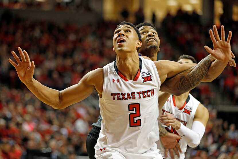 Texas Tech's Zhaire Smith (2) defends against Kansas State's Amaad Wainright (23) during a...