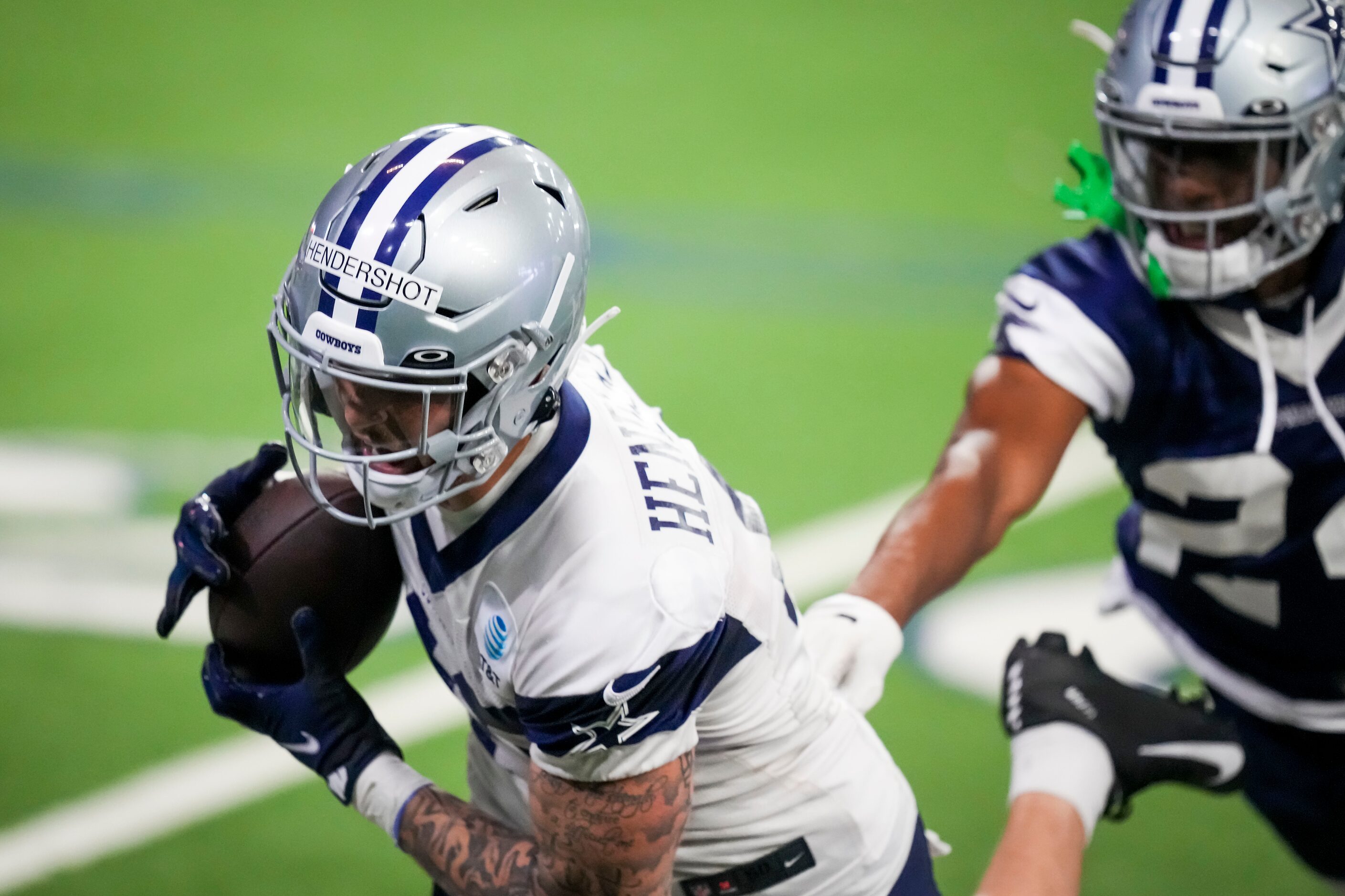 Dallas Cowboys tight end Peyton Hendershot (49) makes a catch as safety Israel Mukuamu (24)...