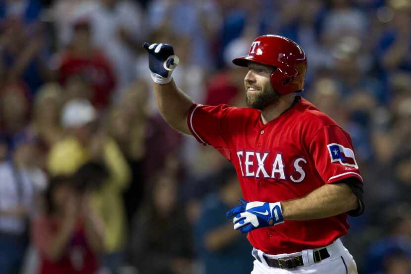 ARLINGTON, TX - APRIL 19:  Kevin Kouzmanoff #6 of the Texas Rangers celebrates after a home...