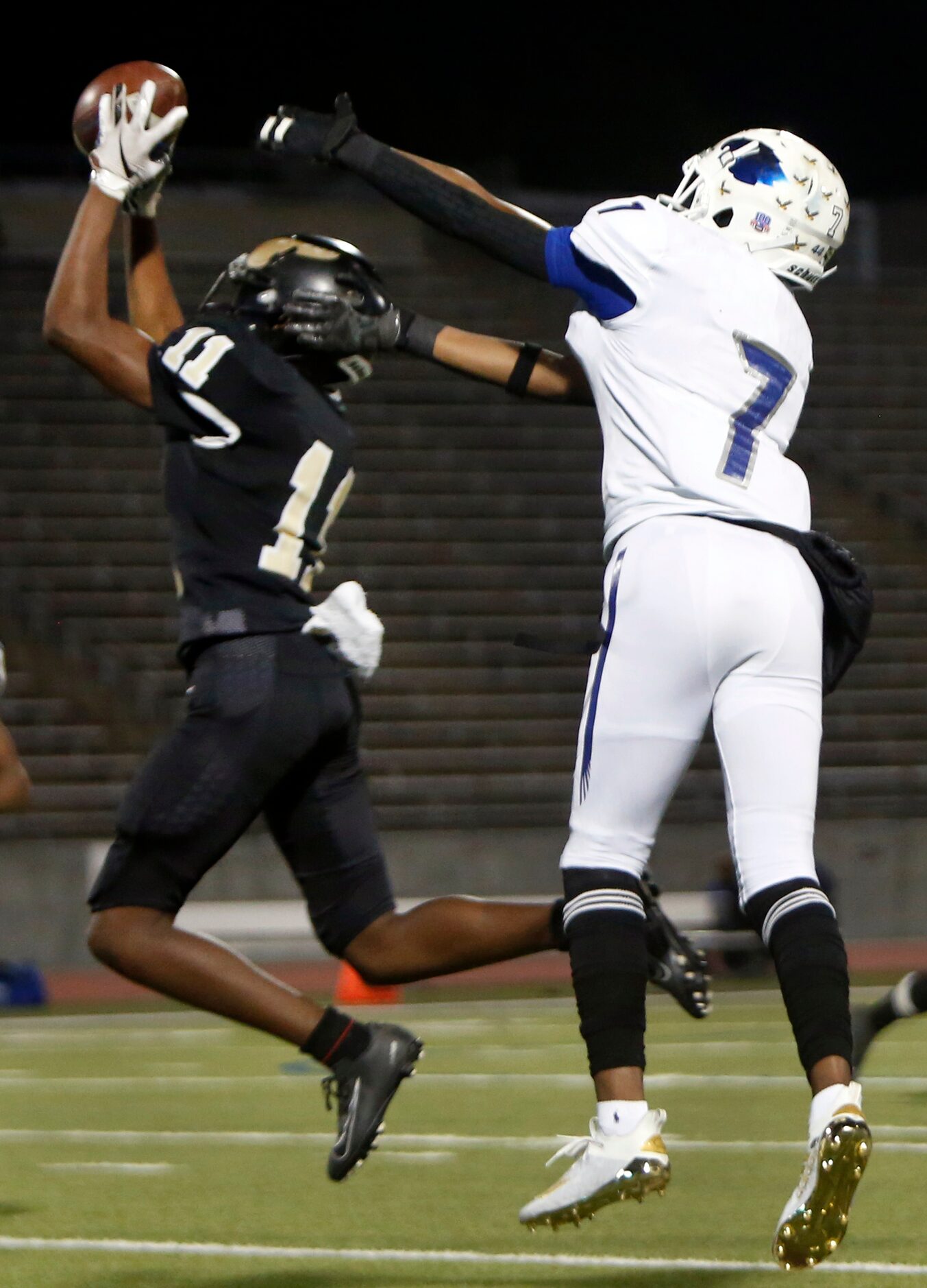 Dallas Pinkston cornerback Michael Landon (11) leaps to make an interception in front of...