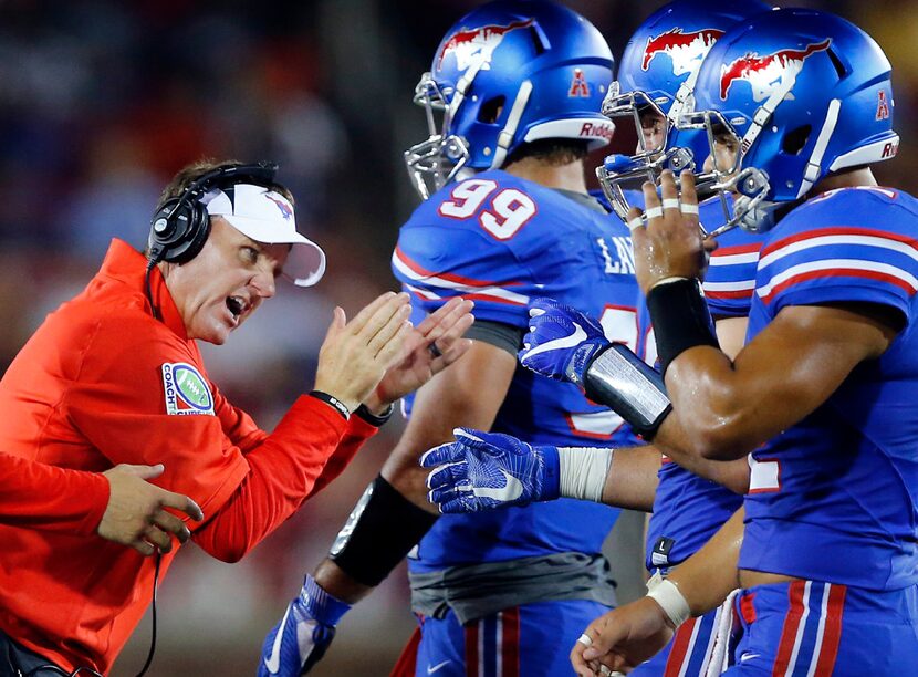 Southern Methodist Mustangs head coach Chad Morris encourages his players to keep fighting...