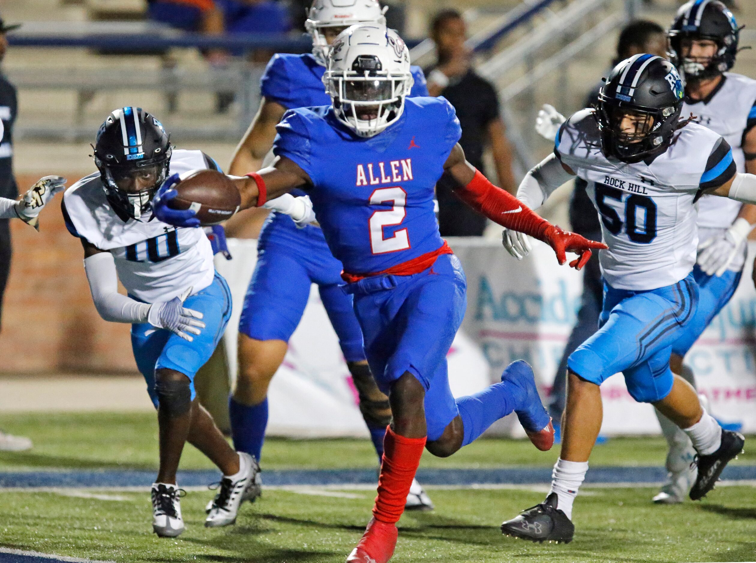 Allen High School running back Kayvion Sibley (2) stretches the ball across the goal line...