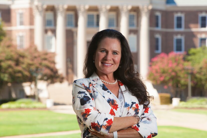 Dr. Elizabeth Loboa standing in front of a building at SMU.